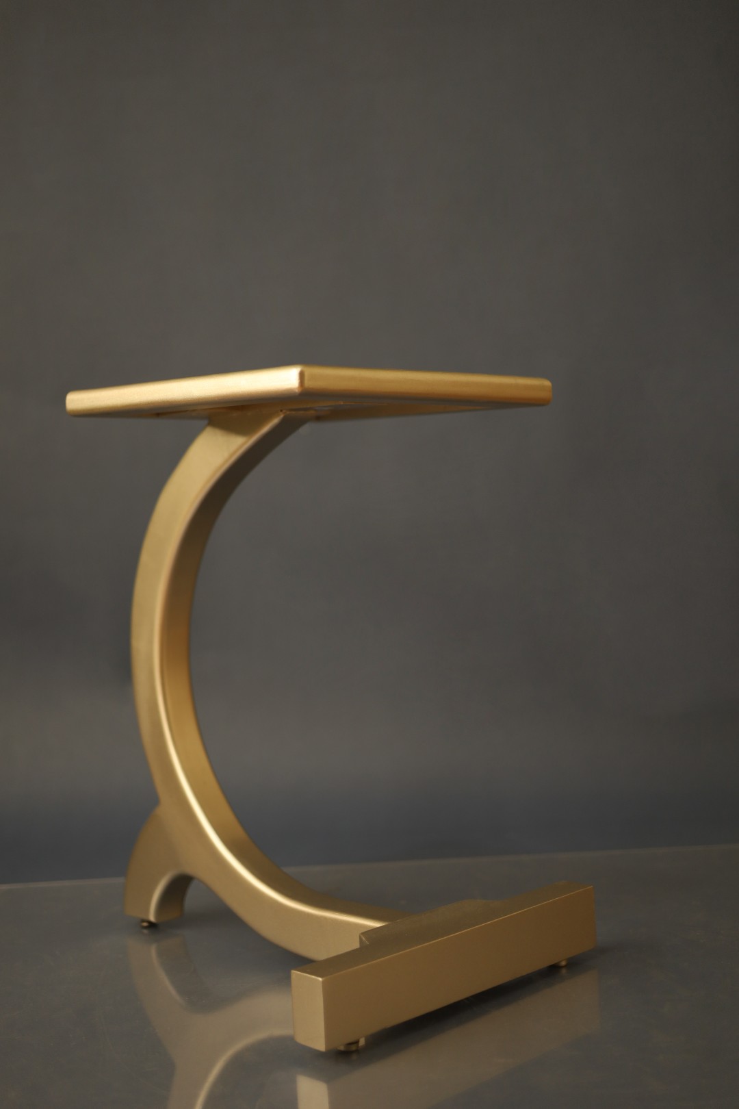 Custom C side table finished in gold