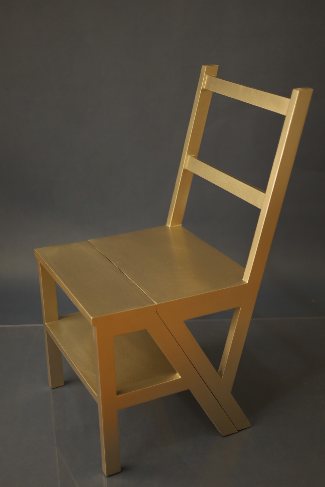Gilded step chair finished in matte gold