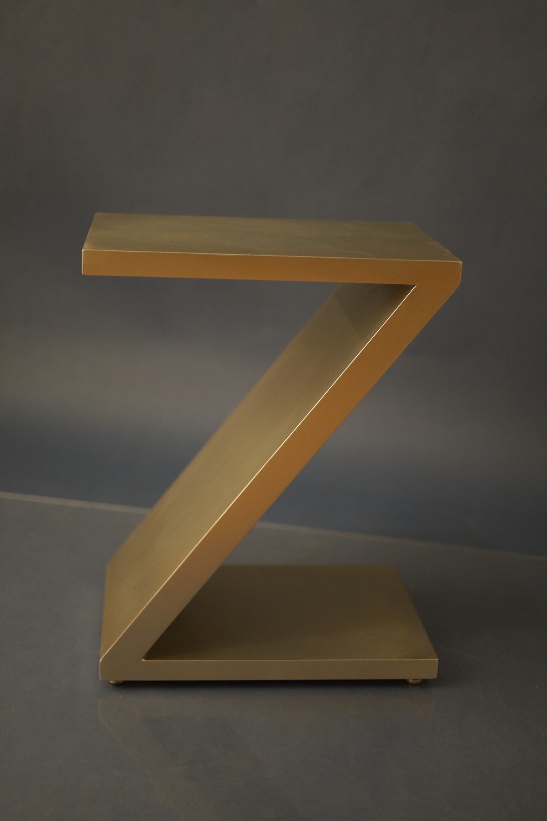 Gilded Z side table finished in matte gold