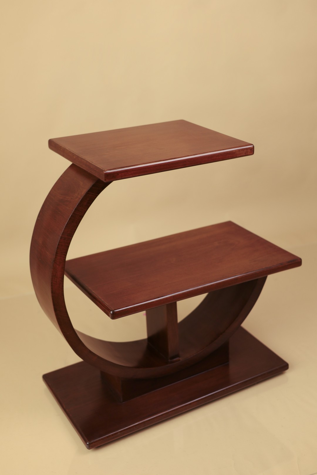 Custom round side table in mahogany, angled view
