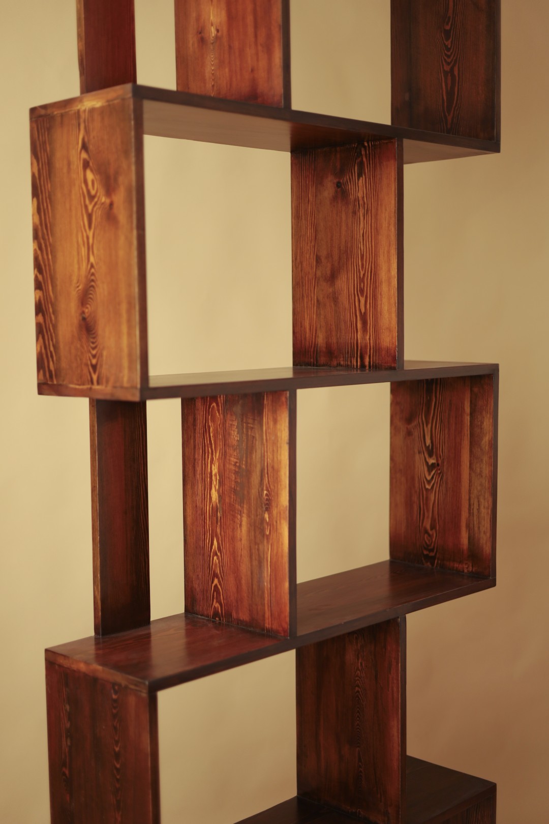 Tall staggered pine shelving unit with interlocking open boxes