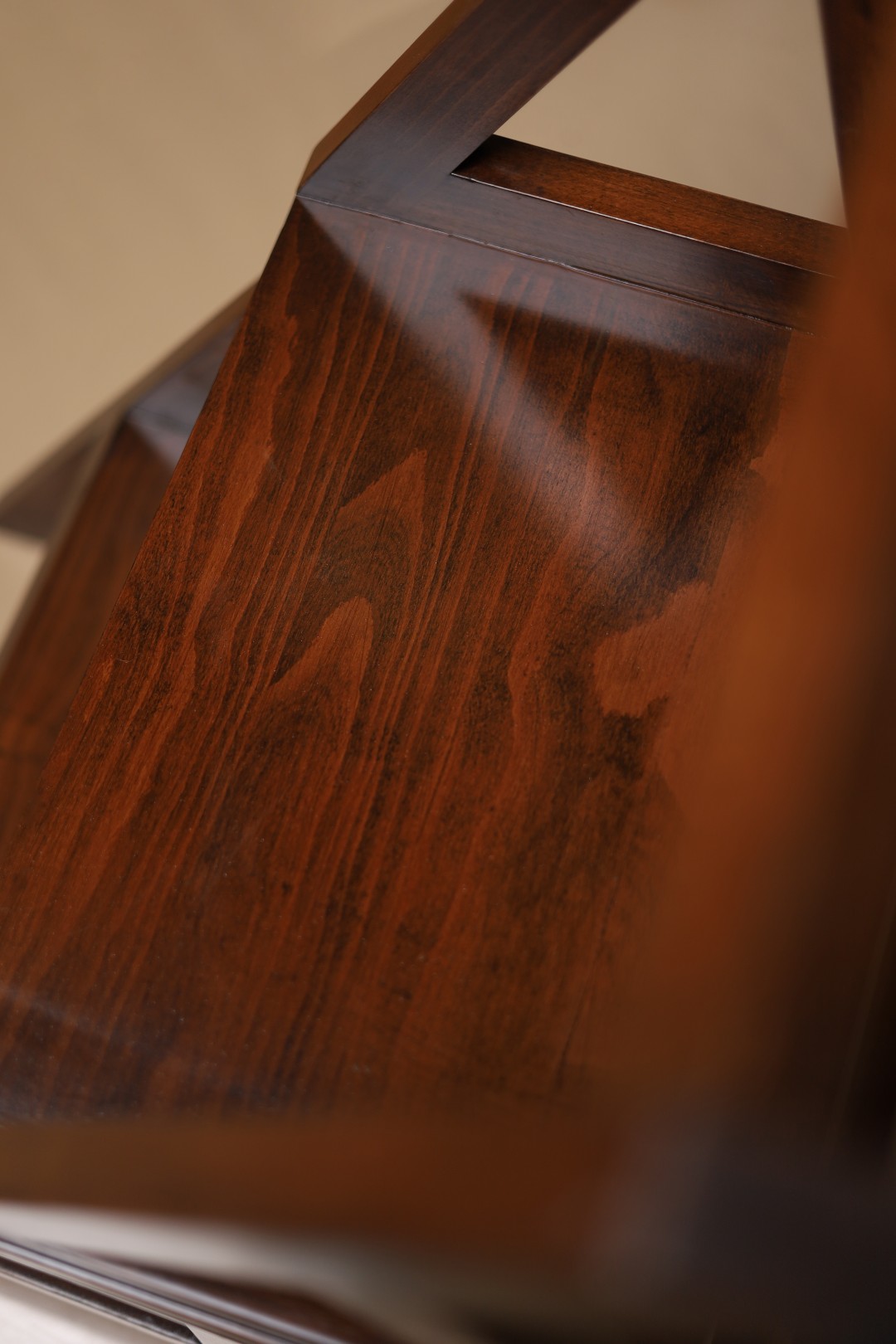 Close-up of dark timber grain on a finished Redmoor tabletop